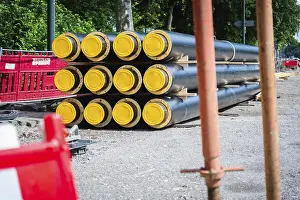 Alternative Energy Solutions Prints: A stack of district heating pipes on a construction site in Dusseldorf