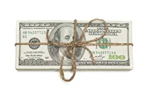 One Hundred Dollar Notes Prints: Stack of one hundred dollar bills tied in a burlap string isolated on a white background