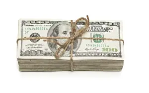 One Hundred Dollar Note Prints: Stack of one hundred dollar bills tied in a burlap string isolated on a white background