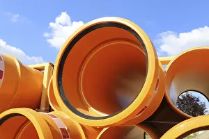 Deserted Construction Area Germany Prints: Stack of KG pipes on a construction site in the Mutterstadt development area