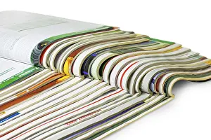 Bright White Background Cutout Prints: Stack of magazines isolated on white background