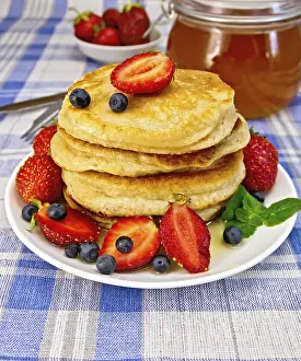 Healthy Breakfast Ideas Prints: A stack of pancakes with strawberries