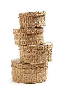 Wicker Baskets Prints: Stack of various sized wicker baskets isolated on white