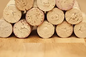 Deserted Wine Cellar Prints: Stack of wine corks on a wood surface