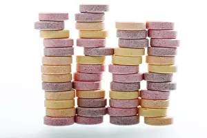 Studio Shot Of Grapes Prints: Stacks of multicoloured grape sugars