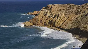 Aegean Sea Waves Prints: Steep cliffs with rolling waves under a clear sky