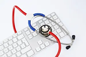 Austria Healthcare System Prints: Stethoscope and keyboard of a computer