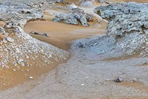 Oman Desert Landscape Prints: Striking cliffs surrounded by windswept sand structures