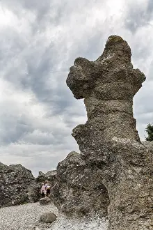 Raukar Limestone Column Prints: Stroller next to bizarre rocket