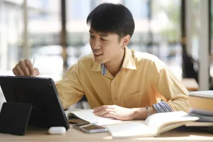 Online Learning Prints: A student engaged in online learning