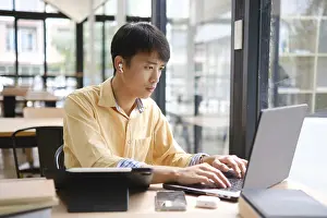 Online Learning Prints: A student engaged in online learning