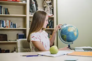 Educational Institution Training Prints: Student posing with globe table