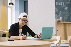 Educational Institution Architecture Prints: Student working with laptop