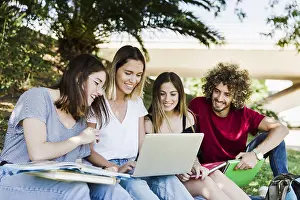 University Campus Lifestyle Prints: Students using laptop park