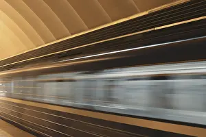 Deserted Train Station Prints: Subway platform with moving fast train