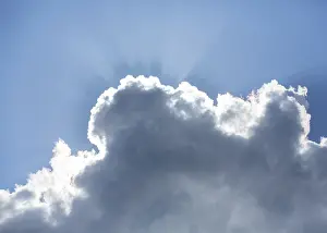 Cloudy Daytime Scene Prints: Sun behind a cloud in the blue sky