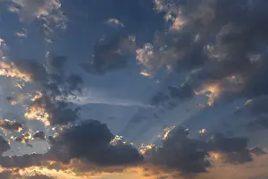 Southern Germany Sunset Prints: Sun behind the clouds in the evening sky