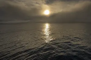 Arctic Ocean Photography Prints: Sun behind clouds, sea surface
