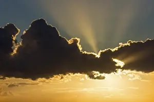 Deserted Evening Sky Prints: Sun behind dark cloud, Germany