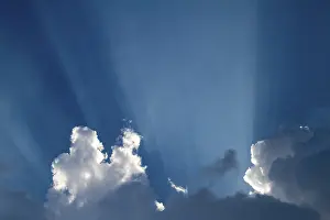 Weather Forecast Images Prints: Sun rays behind clouds