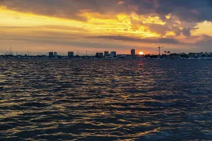 Images Dated 9th January 2024: The sun sets over a calm coastal bay