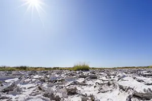 Namibia Desert Landscape Photography Prints: Sunrays shine on drought mud patterns