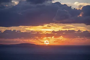 Deserted Greek Island Prints: Sunrise behind the clouds, atmospheric dramatic cloudy sky