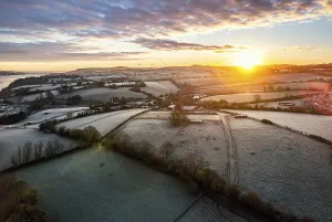 British Countryside Aerials Prints: Sunrise over Fields and River Teign from a drone