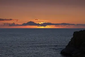 Sunset Over Atlantic Ocean Prints: Sunset behind clouds on the Atlantic Ocean