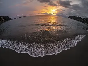 Deserted Coastal Area Italy Prints: Sunset behind clouds over the sea