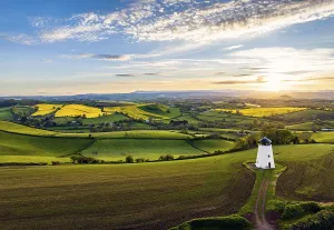 Evening Light Landscape Photo Prints: Sunset over Devon Windmill from a drone