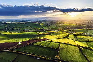Sunset In Northern Europe Prints: Sunset of Devon Windmill over Fields and Farms from a drone