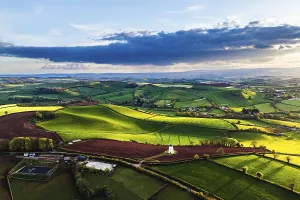 British Countryside Landscape Prints: Sunset of Devon Windmill over Fields and Farms from a drone