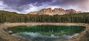 Evening Atmosphere In The Alps Prints: Sunset, dramatic clouds, Latemar group reflected in the Karersee
