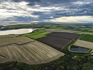 Evening Sun Over Farmland Prints: Sunset over Fields and Farms from a drone