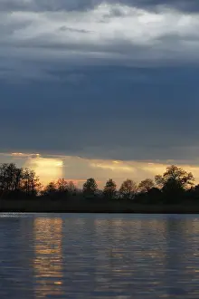Nature Park Peenetal River Landscape Prints: Sunset over the river with dramatic clouds