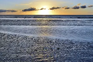 Sandy Ocean Beach At Sunset Prints: Sunset on sandy beach with wave-like structures