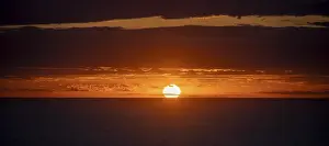 Atmospheric Sunset Europe Prints: Sunset over the sea, with dramatic clouds