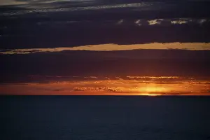 Evening Atmosphere Spain Prints: Sunset over the sea, with dramatic clouds