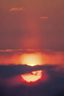 Deserted Sunset Prints: Sunset, sun behind clouds