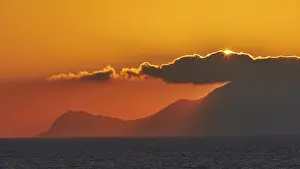 Sicily Sunset Prints: Sunset, sun disc behind clouds