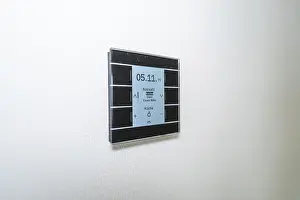Minimalism In Interior Design Prints: A switch with a display on a white wall