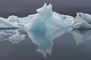 South Iceland Landscape Prints: Symmetrical ice structures reflected in the calm water