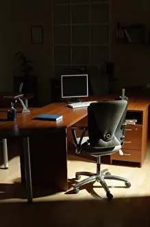 Deserted Office Space Prints: Table, chair and computer at night at office