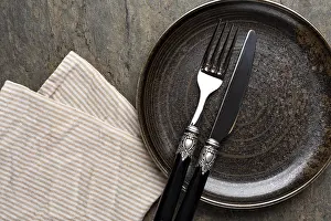 Table Setting Ideas Prints: Table setting. plate, knife and fork on stone background