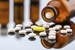 Medical Care Concept Photo Prints: Many tablets with a glass container