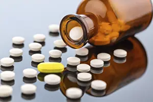 Symbolic Pill Image Prints: Many tablets with a glass container