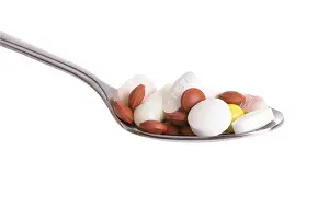 Healthcare Costs Prints: Tablets on a spoon