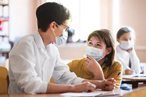 Face Mask Protection Prints: Teacher with mask explaining class