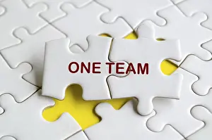 Teamwork Concept Prints: One Team text on missing jigsaw puzzle